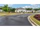 An elegant white two-story home with dark trim, a manicured lawn, and a circular driveway at 3638 Silvery Way, Powder Springs, GA 30127