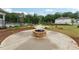A community fire pit sits among manicured lawns, near the pool and playground, perfect for neighborhood gatherings at 3638 Silvery Way, Powder Springs, GA 30127