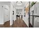 Inviting foyer with dark hardwood floors, modern decor, and views into the living area at 3638 Silvery Way, Powder Springs, GA 30127