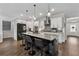 Contemporary kitchen featuring a kitchen island, stainless steel appliances, and sleek lighting at 3638 Silvery Way, Powder Springs, GA 30127