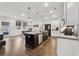 Modern kitchen with a large island, white cabinetry, and seamless access to the dining area at 3638 Silvery Way, Powder Springs, GA 30127