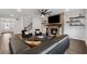 Comfortable living room with a cozy fireplace, a staircase, and views of the front entryway at 3638 Silvery Way, Powder Springs, GA 30127