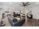 Spacious living area flowing into the kitchen, showcasing sleek finishes and abundant natural light at 3638 Silvery Way, Powder Springs, GA 30127