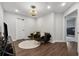 Bright living room featuring modern furniture, recessed lights, and dark hardwood flooring at 3638 Silvery Way, Powder Springs, GA 30127