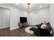 Bright living room featuring modern furniture, recessed lights, and dark hardwood flooring at 3638 Silvery Way, Powder Springs, GA 30127