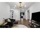 Bright living room featuring modern furniture, recessed lights, and dark hardwood flooring at 3638 Silvery Way, Powder Springs, GA 30127