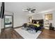 This main bedroom is complete with dark hardwood floors and a large mirror at 3638 Silvery Way, Powder Springs, GA 30127