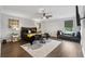 Spacious main bedroom featuring a large bed, a sitting area, and ample natural light at 3638 Silvery Way, Powder Springs, GA 30127