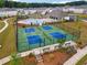 A pickleball court is next to the pool with seating and manicured landscaping at 3638 Silvery Way, Powder Springs, GA 30127