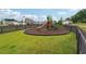 A fenced playground on a well-maintained lawn in a residential neighborhood at 3638 Silvery Way, Powder Springs, GA 30127