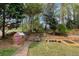 Private backyard featuring a storage shed, garden beds, and plenty of space for enjoying outdoor activities and gardening at 577 Mountain Oaks Pkwy, Stone Mountain, GA 30087