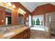 Relaxing bathroom featuring a soaking tub, separate shower, double sink vanity, and plenty of natural light, a spa-like retreat at 577 Mountain Oaks Pkwy, Stone Mountain, GA 30087