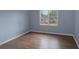 Bright bedroom showcasing new floors, a window for natural light, and plenty of space for creating a personalized retreat at 577 Mountain Oaks Pkwy, Stone Mountain, GA 30087