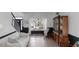 Cozy living room showcasing new floors, a large window, a curio cabinet, and a comfortable seating area for relaxing at 577 Mountain Oaks Pkwy, Stone Mountain, GA 30087