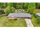 Aerial shot showcasing the charming brick home, the lush backyard, and a refreshing pool at 690 Manor Ridge Sw Dr, Mableton, GA 30126