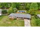 Aerial view of the house and backyard featuring a pool and mature landscaping at 690 Manor Ridge Sw Dr, Mableton, GA 30126