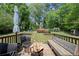 Spacious backyard featuring a fire pit, sitting area, and pool in a lush green setting at 690 Manor Ridge Sw Dr, Mableton, GA 30126