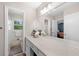 Bright bathroom with a large vanity mirror, ample counter space, and white cabinets at 690 Manor Ridge Sw Dr, Mableton, GA 30126
