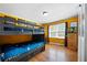 Bedroom with a bunk bed, hardwood floors, and a window at 690 Manor Ridge Sw Dr, Mableton, GA 30126