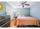 Bedroom featuring hardwood floors, a ceiling fan, and ample natural light at 690 Manor Ridge Sw Dr, Mableton, GA 30126