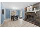 Charming dining area featuring a fireplace, built-in cabinets, and tile flooring at 690 Manor Ridge Sw Dr, Mableton, GA 30126