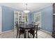 Cozy dining area with cabinet storage, chandelier, and natural light at 690 Manor Ridge Sw Dr, Mableton, GA 30126