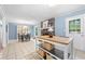Dining area with fireplace, kitchen island, and access to the backyard at 690 Manor Ridge Sw Dr, Mableton, GA 30126