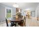 Bright dining room with backyard views, adjacent to the kitchen at 690 Manor Ridge Sw Dr, Mableton, GA 30126