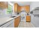 Bright kitchen featuring tile floors, white countertops and ample cabinet space at 690 Manor Ridge Sw Dr, Mableton, GA 30126
