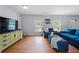 Inviting living room with hardwood floors, comfortable seating, and lots of natural light at 690 Manor Ridge Sw Dr, Mableton, GA 30126