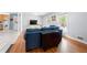 Open-concept living room with hardwood floors and abundant natural light at 690 Manor Ridge Sw Dr, Mableton, GA 30126