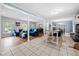 Bright, open living room with hardwood floors connecting dining and seating areas at 690 Manor Ridge Sw Dr, Mableton, GA 30126