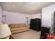 Finished basement features a cozy seating area with a comfortable sofa and large television at 104 Lumby Ln, Stockbridge, GA 30281
