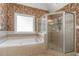 The bathroom features a soaking tub and glass-enclosed shower at 104 Lumby Ln, Stockbridge, GA 30281