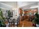 Bright kitchen breakfast area with hardwood floors, large windows, and pendant lighting at 104 Lumby Ln, Stockbridge, GA 30281