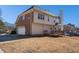 Back of house with large yard, detached garage, and wood deck at 104 Lumby Ln, Stockbridge, GA 30281