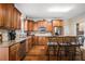 Kitchen features granite countertops, stainless steel appliances, hardwood floors, and an island with bar seating at 104 Lumby Ln, Stockbridge, GA 30281
