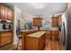Kitchen with stainless steel appliances, hardwood floors, breakfast bar seating and eat-in kitchen area at 104 Lumby Ln, Stockbridge, GA 30281