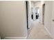Carpeted hallway with doors leading to various rooms, offering a glimpse into the home's layout at 166 Fender Walk, Marietta, GA 30060