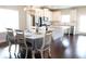 Modern eat-in kitchen with white cabinets, an island with granite countertops, and stainless steel appliances at 166 Fender Walk, Marietta, GA 30060