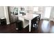 Modern kitchen boasts stainless steel appliances, granite countertops, and an island with seating at 166 Fender Walk, Marietta, GA 30060