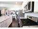 Bright, open kitchen features stainless steel appliances, a center island, and flows seamlessly into the dining area at 166 Fender Walk, Marietta, GA 30060