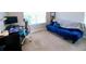 Comfortable office featuring a desk, blue futon, and large window, creating an ideal workspace at 166 Fender Walk, Marietta, GA 30060