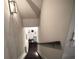 View down staircase highlighting hardwood steps and railing to finished basement at 166 Fender Walk, Marietta, GA 30060