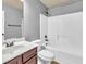 Full bathroom with shower and vanity with wood cabinets at 2603 Dayview Ln, Atlanta, GA 30331