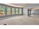 Living room with large windows and carpeted floors, offering natural light at 2603 Dayview Ln, Atlanta, GA 30331