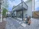 Backyard featuring a deck, patio, and gravel landscaping at 305 Nobleman Way, Canton, GA 30114
