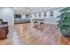 Expansive finished basement with hardwood floors, large couch, and recessed lighting at 305 Nobleman Way, Canton, GA 30114