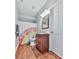 Well-lit bathroom with a vanity, mirror, and a colorful shower curtain at 305 Nobleman Way, Canton, GA 30114