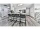 Modern kitchen featuring stainless steel appliances and a breakfast bar with seating for four at 305 Nobleman Way, Canton, GA 30114
